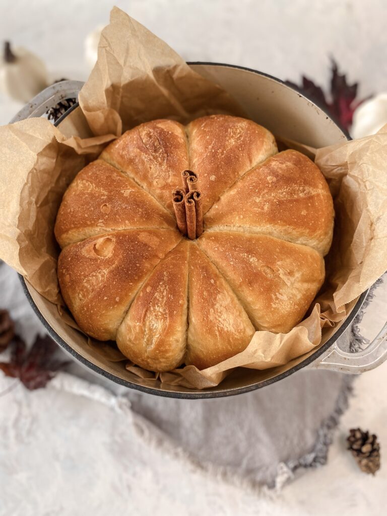 Pumpkin-Shaped Bread in a cast-iron crockpot.