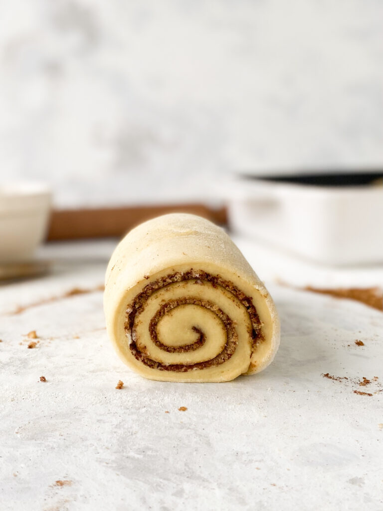 A log of enriched dough rolled with cinnamon sugar filling.