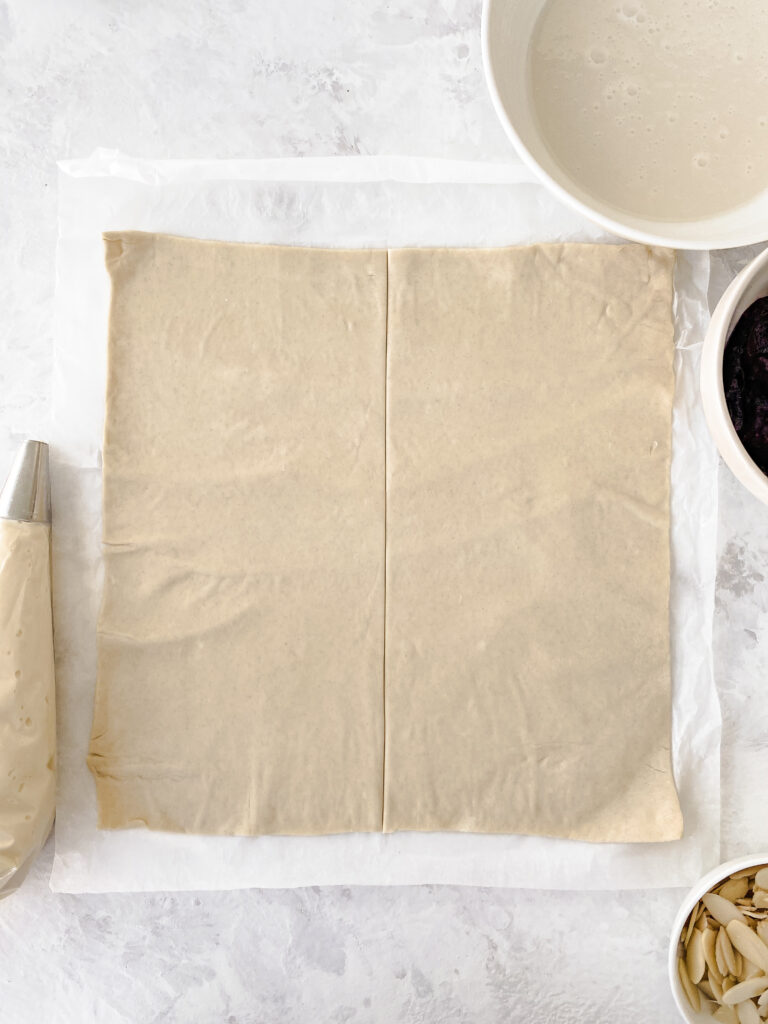 A sheet of puff pastry cut in half.