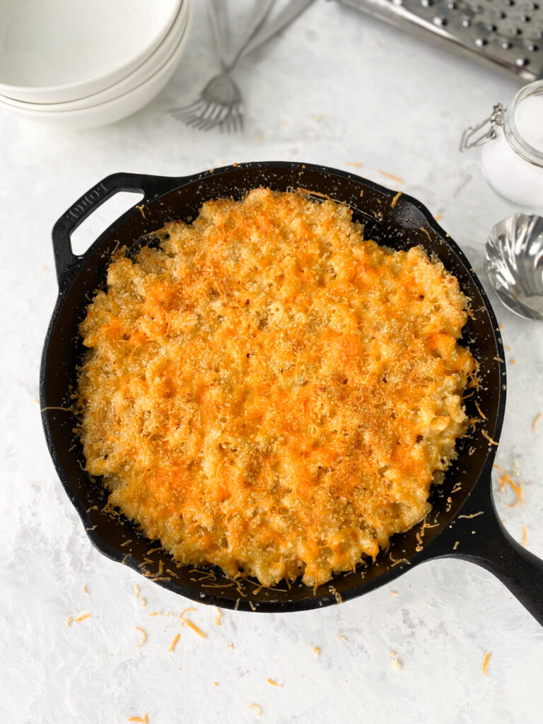 Baked mac and cheese in a cast-iron skillet.