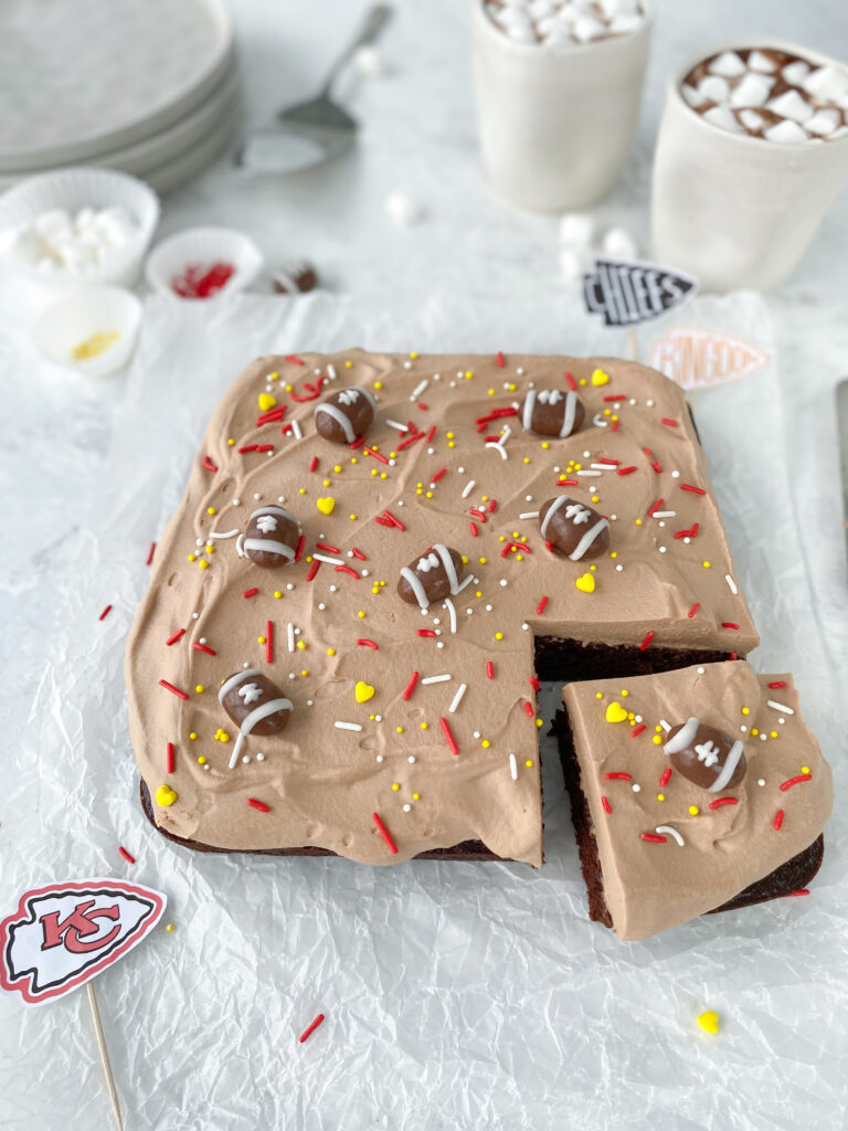 Kansas City Chiefs themed football chocolate mousse cake.