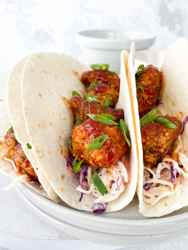 Saucy gochujang broccoli tacos with panko-breaded broccoli, gochujang BBQ sauce, and creamy coleslaw.