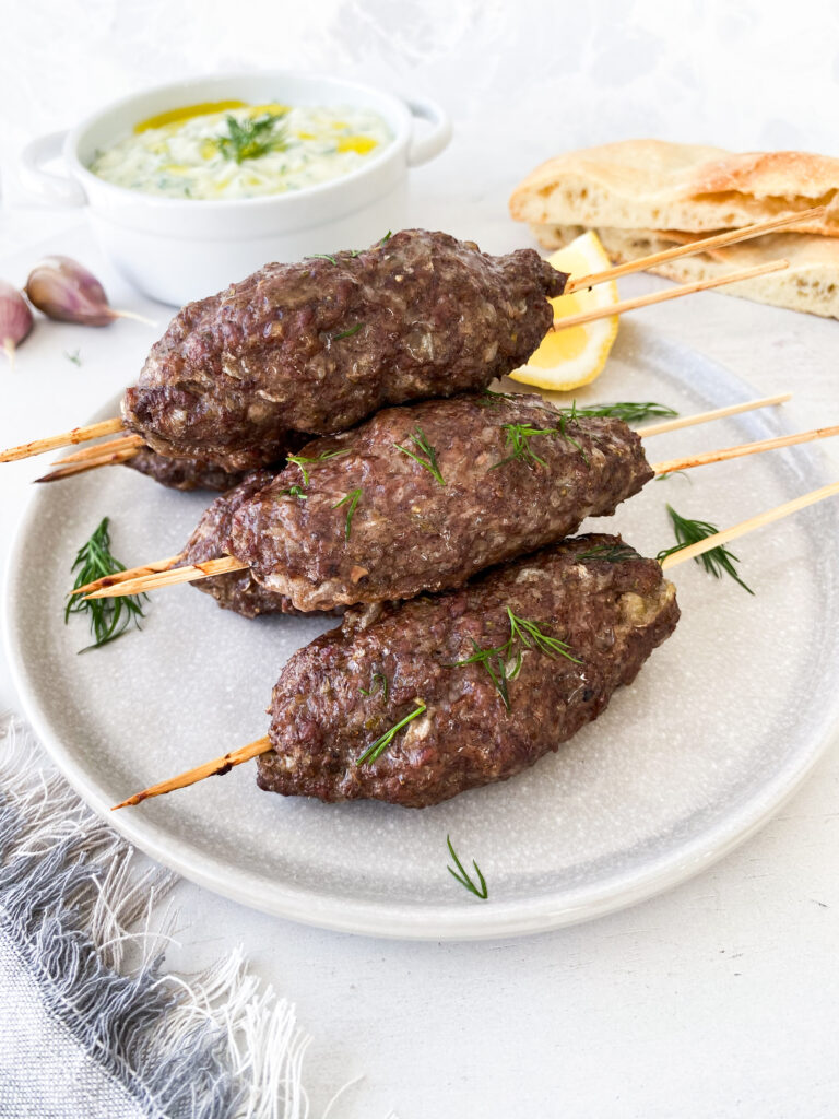 Ground beef kebabs (kofta) served with bright, fresh, garlicky tzatziki.