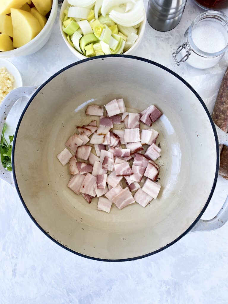 Chopped bacon in a dutch oven.