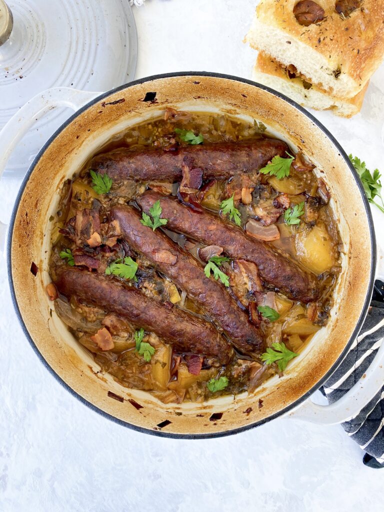 Irish sausage and potato stew (aka Dublin coddle) topped with fresh parsley leaves.