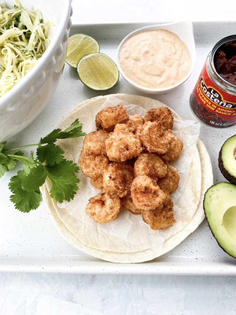 Baja tacos with crispy shrimp, crunchy cabbage slaw, and Baja sauce.
