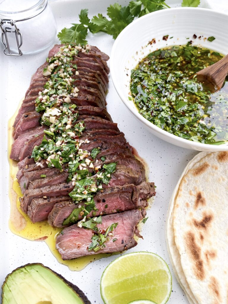 Grilled steak sliced thin and topped with chimichurri sauce.