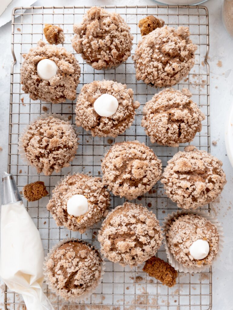 Pumpkin muffins filled with sweet cream cheese filling.