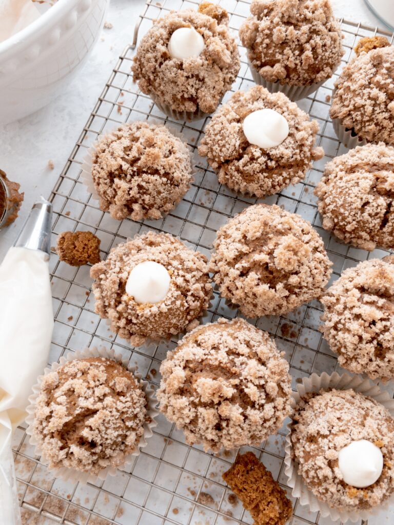 Simple pumpkin muffins topped with cinnamon streusel and filled with sweetened cream cheese. 