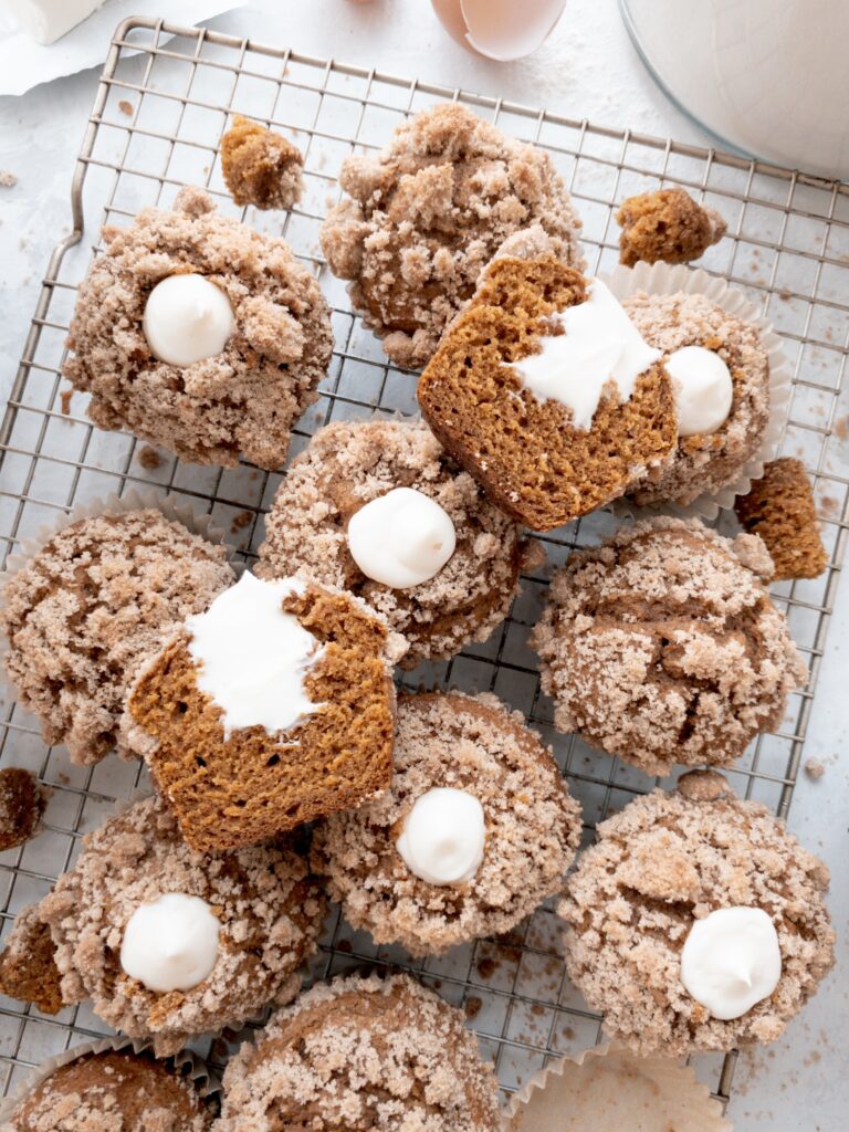 Cream cheese filled pumpkin muffins topped with brown sugar and cinnamon streusel.