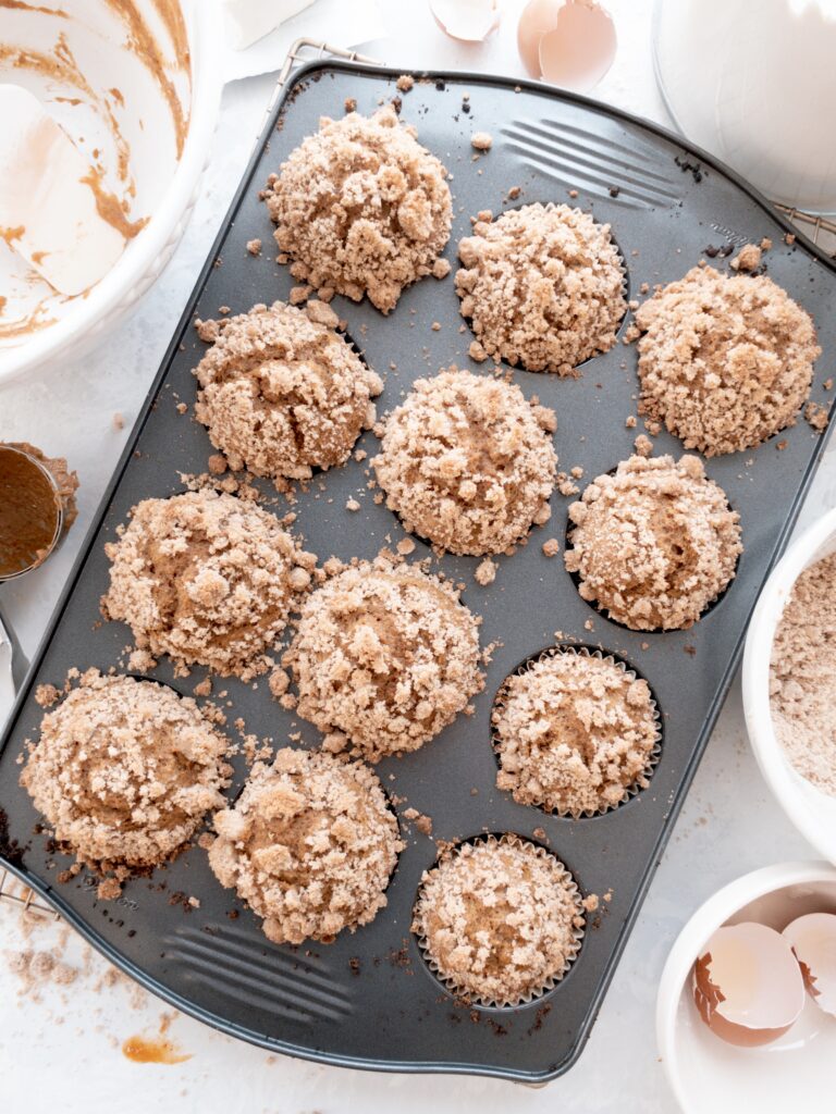 Pumpkin muffins topped with brown sugar streusel fresh from the oven.
