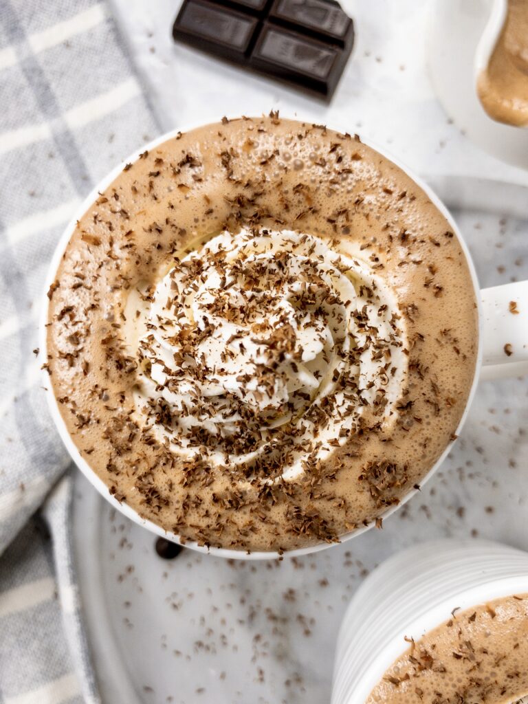 Low Carb Hot Chocolate topped with whipped cream and chocolate shavings.