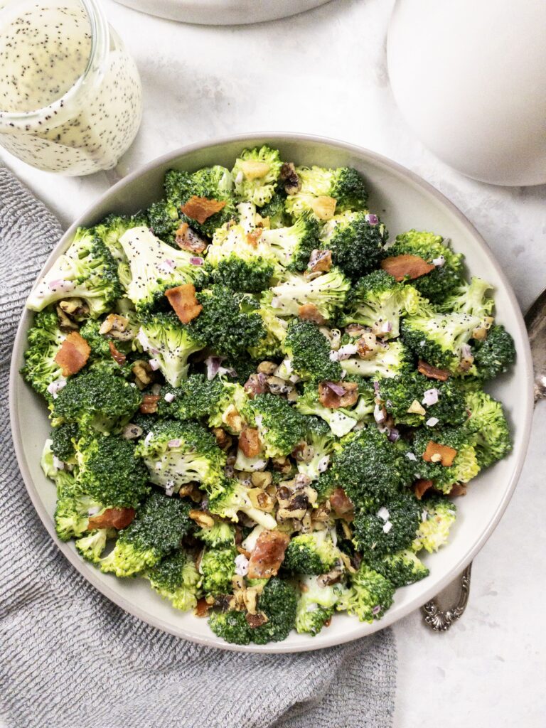 Keto Broccoli Salad with bacon, walnuts, red onion, and creamy poppy seed dressing.