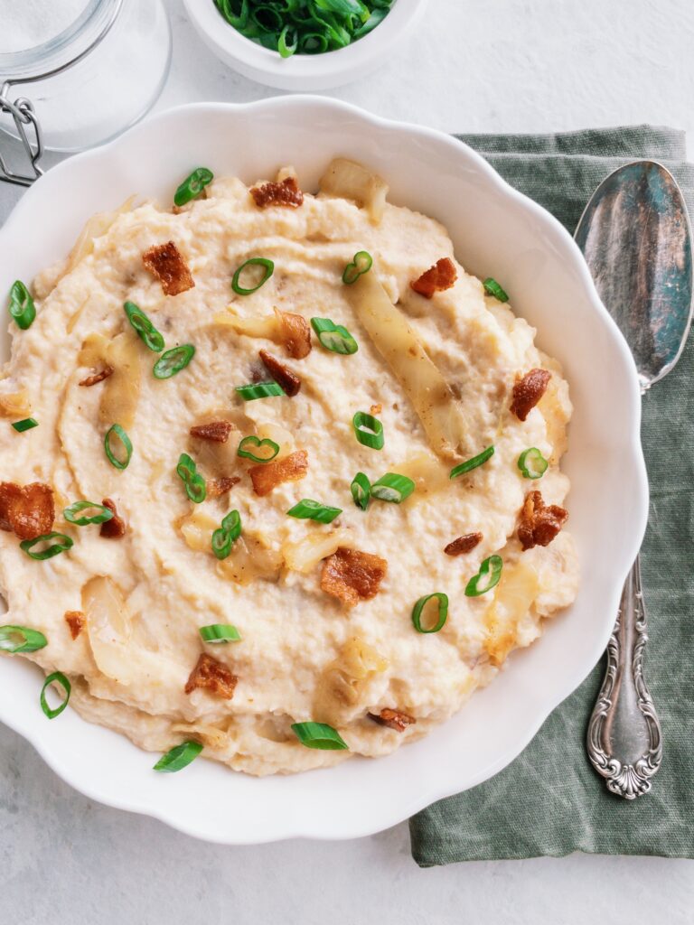 Keto Irish Colcannon made with creamy mashed rutabaga, slow braised cabbage, and smoky bacon for a dish that's hearty and comforting.