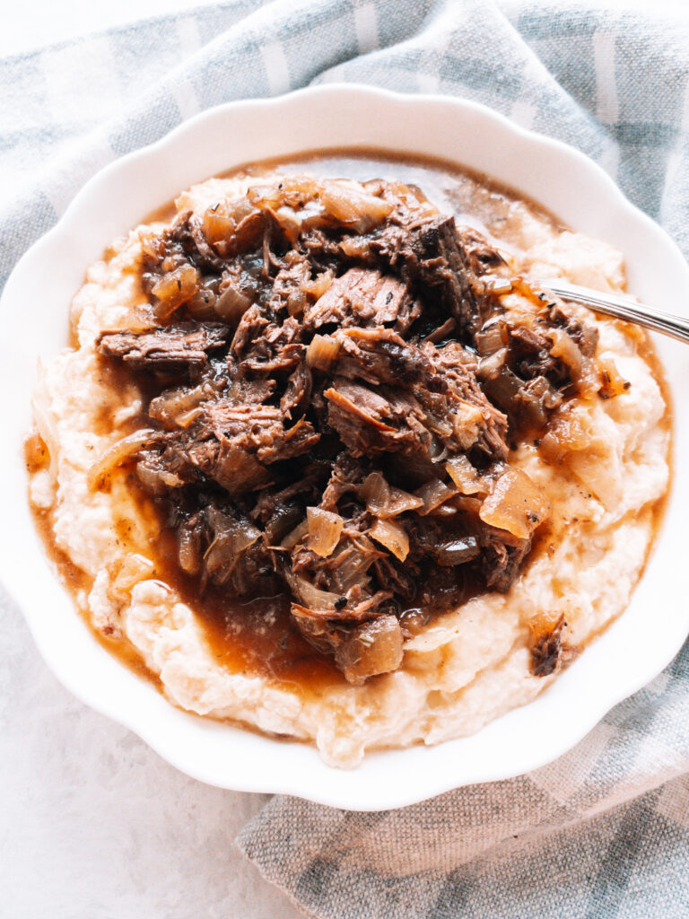French Onion Pot Roast made in the Instant Pot served over creamy mash.