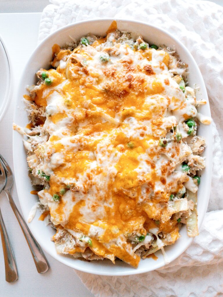 Tuna Casserole topped with melty cheddar, mozzarella, and parmesan for an extra cheesy finish.
