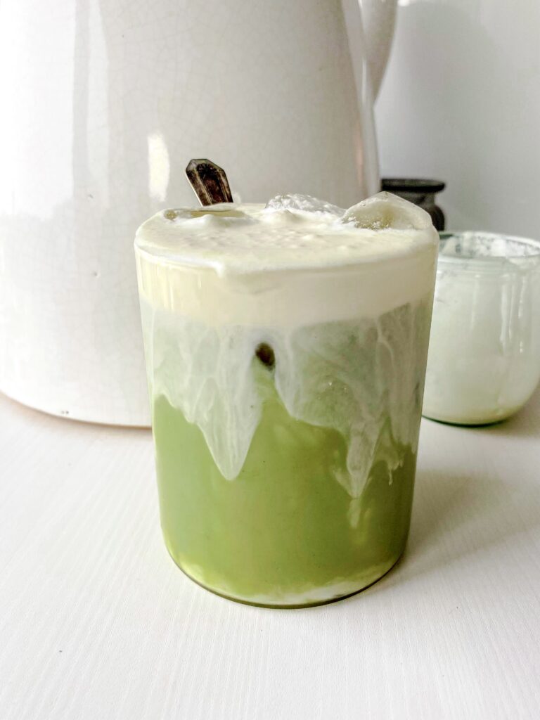 Iced Matcha Latte topped with homemade Copycat Starbucks Sweet Cream Cold Foam.